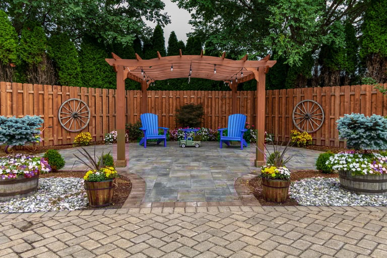 Wooden pergola on pavers landscape design with ornamental flowers and evergreens