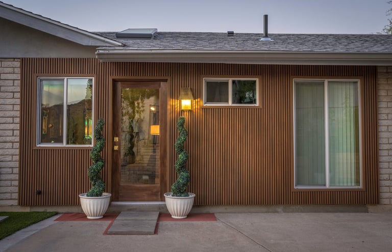 Mid-century house with elegant entrance and driveway